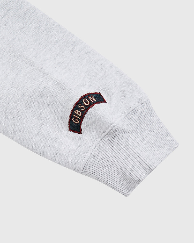 A close-up of an Ebbets Field Karabo Poppy x Josh Gibson heavyweight cotton hoodie sleeve featuring 