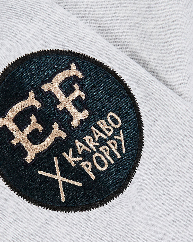 A close-up of a round black patch with beige 