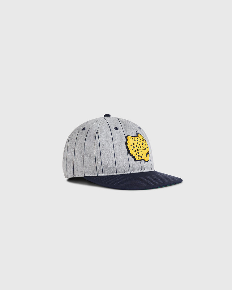 The Ebbets Field Santa Clara Leopardos 1925 Cotton Twill Ballcap features grey fabric with vertical dark stripes, a navy brim, and a yellow jaguar head patch on the front, all set against a plain white background.