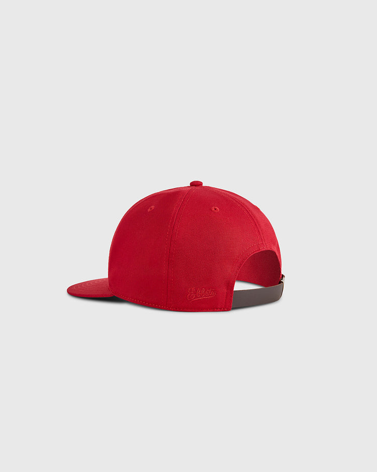 The Ebbets Field Habana Leones Cotton Twill Ballcap is shown from the back, highlighting its red color, dark adjustable strap, and subtle stitching against a plain light gray background.