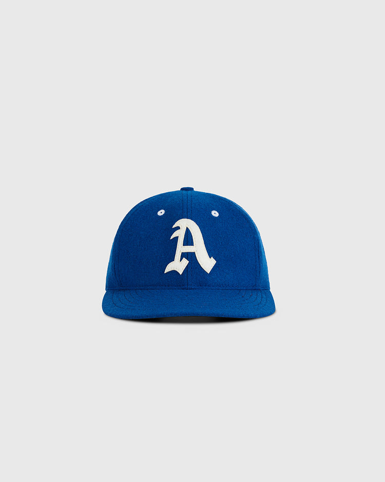 The Ebbets Field Almendares Alacranes 1947 Authentic Wool Ballcap features royal blue vintage wool with a white stylized 