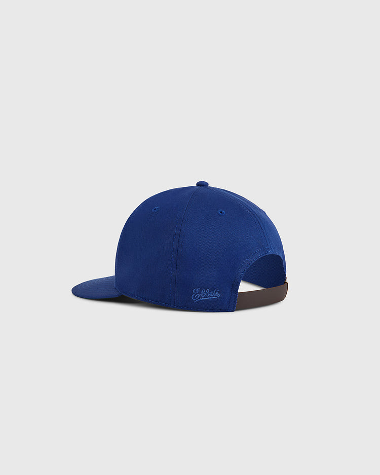 The Ebbets Field Almendares Alacranes Cotton Twill Ballcap is shown from the back with a blue finish, an adjustable brown strap, subtle stitched branding above the opening, and set against a light gray background.