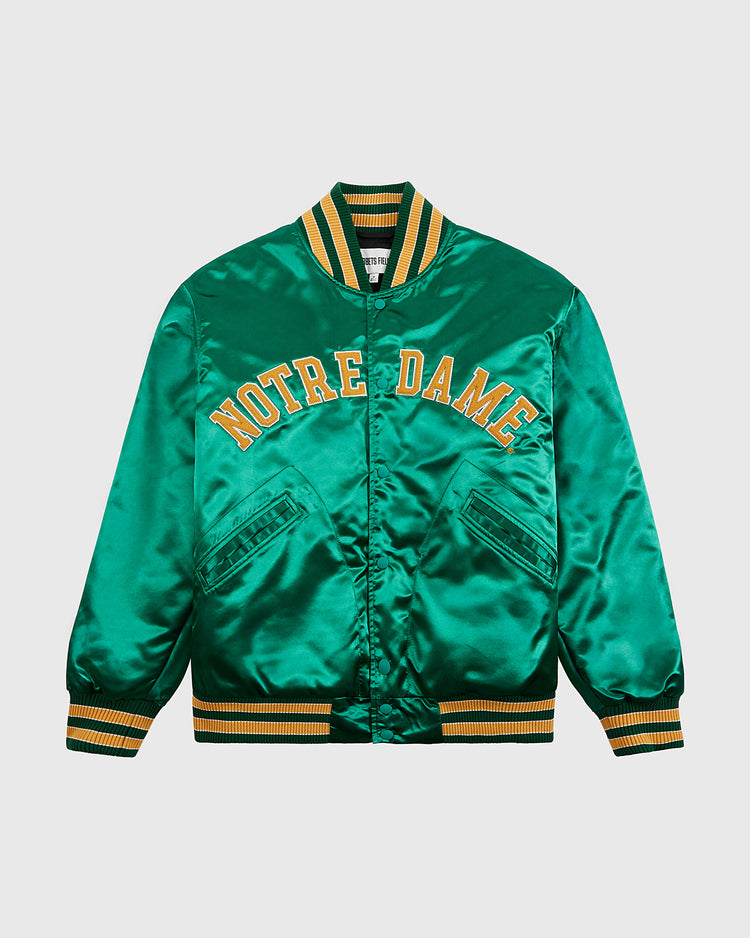 The Ebbets Field Notre Dame Satin Varsity Jacket features yellow “NOTRE DAME” embroidery, yellow and white striped trim, vintage styling, and two front flap pockets.