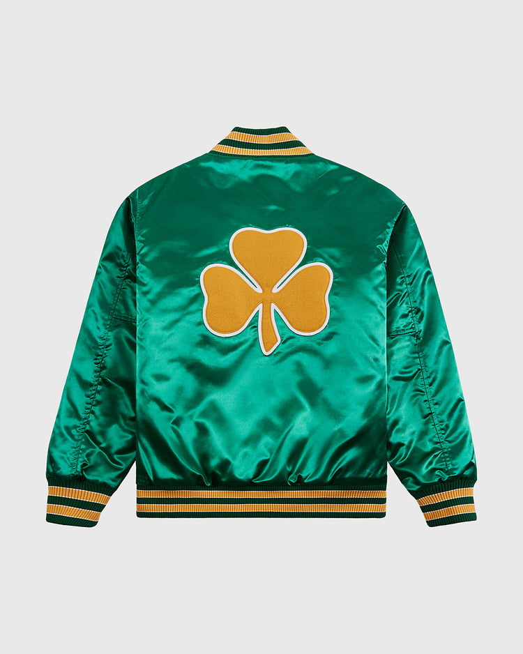 The Ebbets Field Notre Dame Satin Varsity Jacket shines in green satin with yellow and white striped cuffs and collar, plus a bold yellow clover outlined in white on the back for a classic collegiate look.
