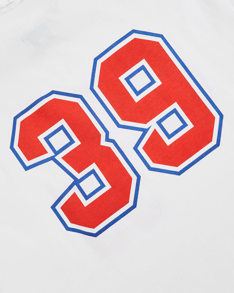 The Ebbets Field Cuba National Team Short Sleeve Graphic Tee features a bold red 39 with a blue outline on white, echoing vintage baseball shirts and honoring the Cuban national team.