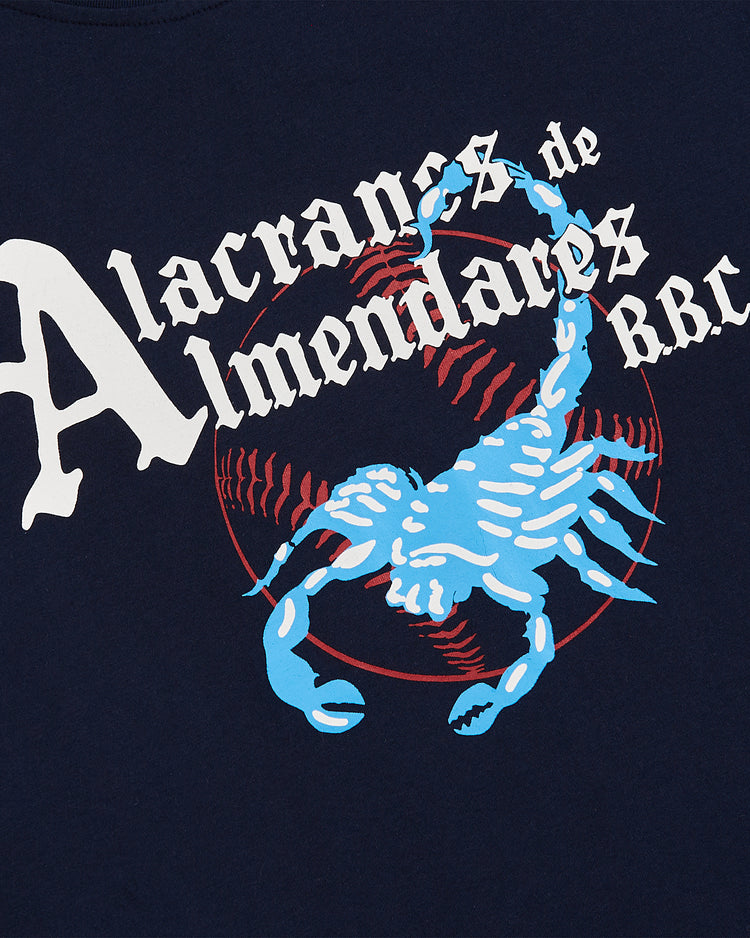 The Ebbets Field Almendares Alacranes Short Sleeve Graphic Tee - Cuban League features a navy blue design with a bold blue scorpion, red baseball stitching, and vintage-inspired 