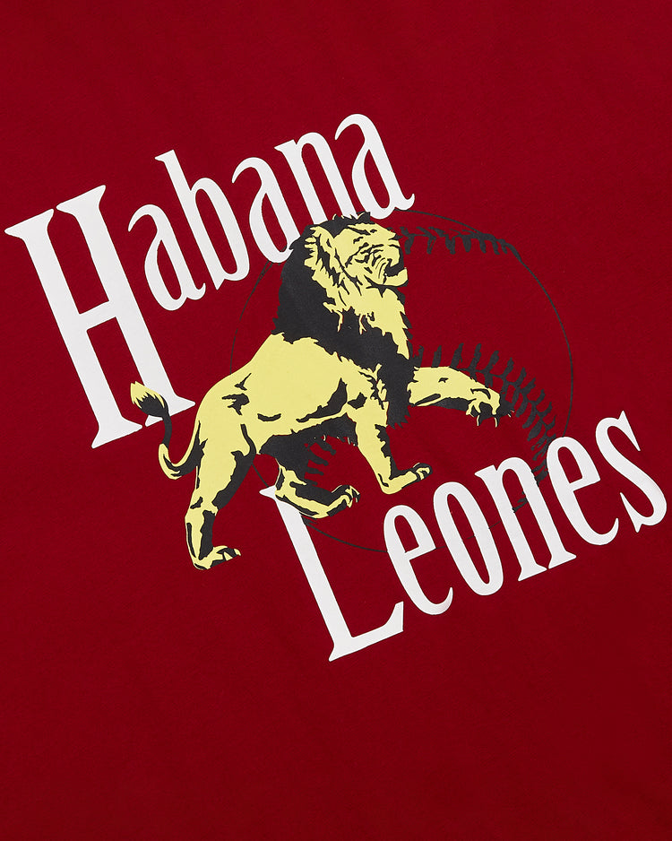 The Ebbets Field Habana Leones Short Sleeve Graphic Tee features a yellow and black lion over a faint baseball on red, with 