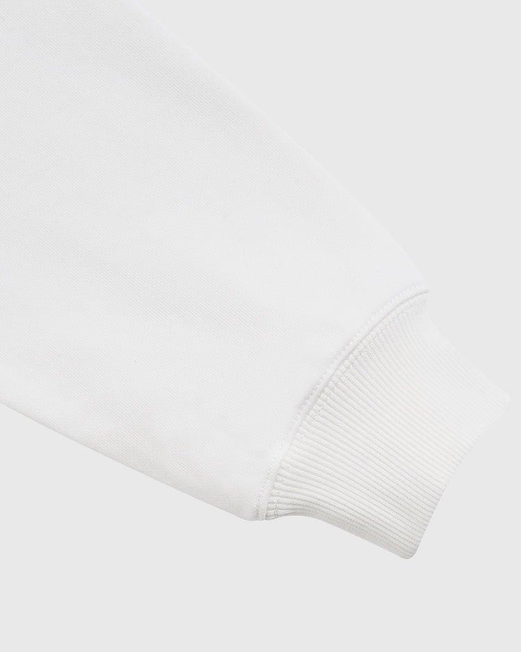 Close-up of the cuff on the Diablos Rojos del Mexico Heavyweight Cotton Terry Pullover Hoodie by Ebbets Field, showing ribbed fabric at the wrist for a classic, comfortable finish against a plain light background.