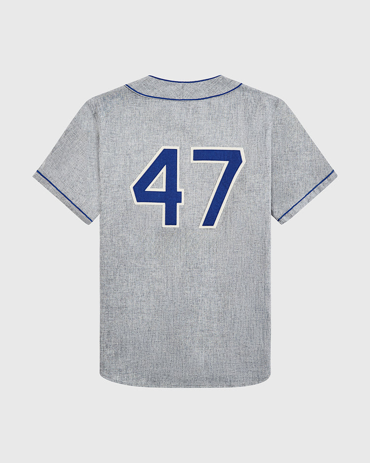 The EFF Cuba National Team 1947 Authentic Wool Road Baseball Jersey is gray with blue trim, features short sleeves, and a large blue number 47 on the back, designed as a vintage replica.
