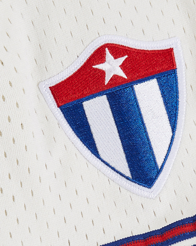 The Havana Cubans Mesh Button-Up Jersey by Ebbets Field features a white vintage look with a stitched shield emblem—red top, white star, and blue and white stripes—evoking classic minor league baseball style.