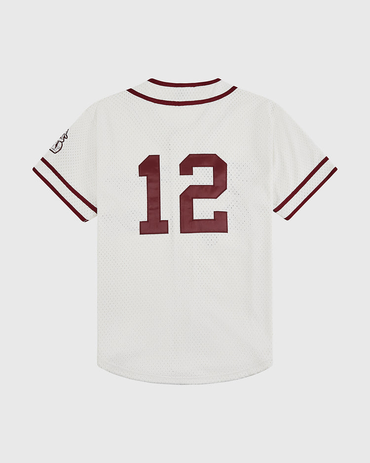 The Ebbets Field Texas A&M University 1952 Button-Up Mesh Jersey features maroon-striped collar and sleeves, a large maroon 12 on the back, and a left-sleeve graphic, evoking the classic style of vintage Aggies baseball uniforms.