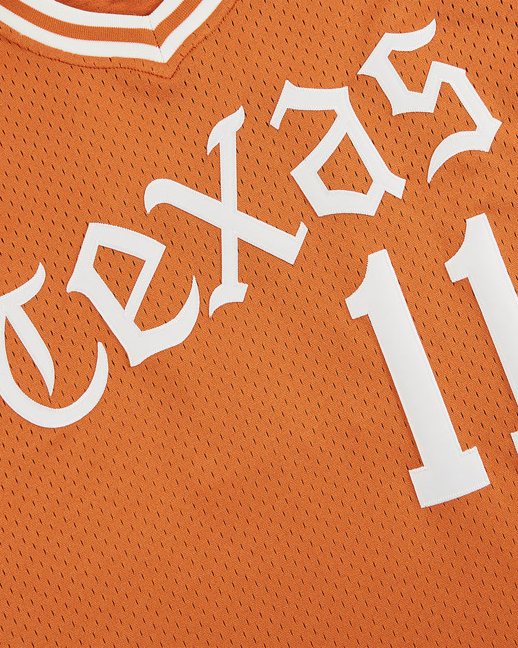 Close-up of the Ebbets Field University of Texas 1982 V-Neck Mesh Jersey, featuring bold white 