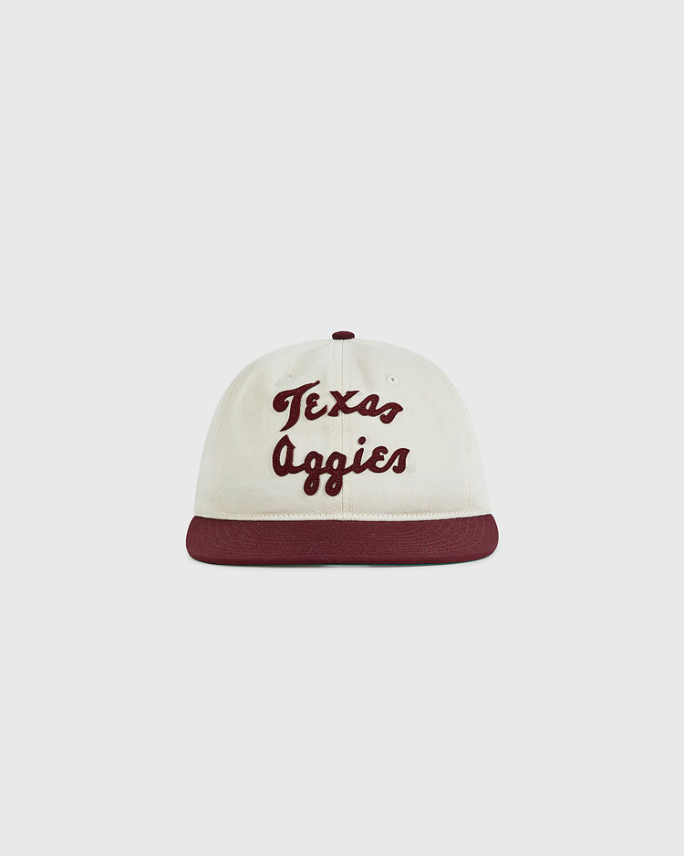 The Ebbets Field Texas A&M University 1952 Cotton Twill Ballcap is a vintage white hat with a maroon brim and 