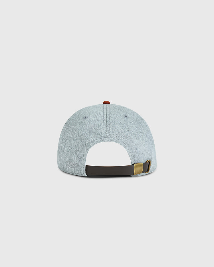 The Ebbets Field University of Texas 1943 Cotton Twill Ballcap, shown from the back, features light blue cotton twill, an adjustable dark strap with brass buckle, and a small red button on top. Background is plain white.
