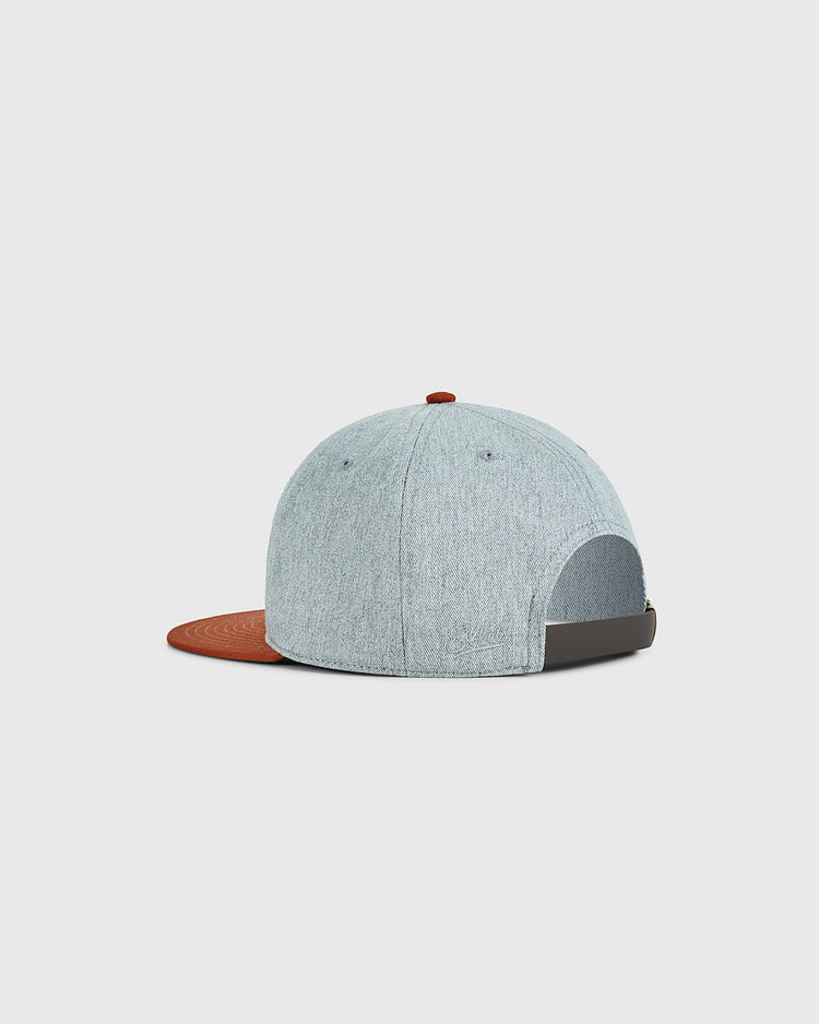 The Ebbets Field University of Texas 1943 Cotton Twill Ballcap features light gray cotton twill, a brown brim and button, an adjustable black strap, and a classic rear opening inspired by the 1943 Longhorns.