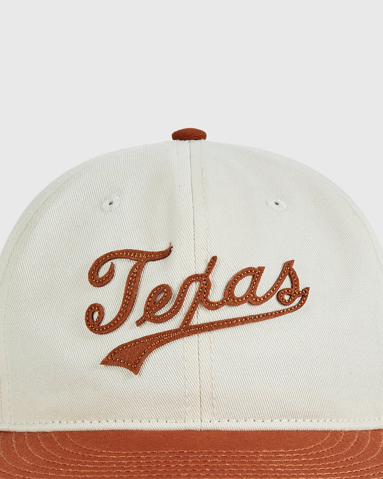 A close-up of the Ebbets Field University of Texas 1975 Cotton Twill Ballcap, featuring cream cotton twill, 