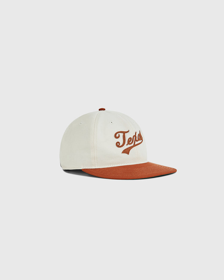 The Ebbets Field University of Texas 1975 Cotton Twill Ballcap features a cream crown, brown brim, and 