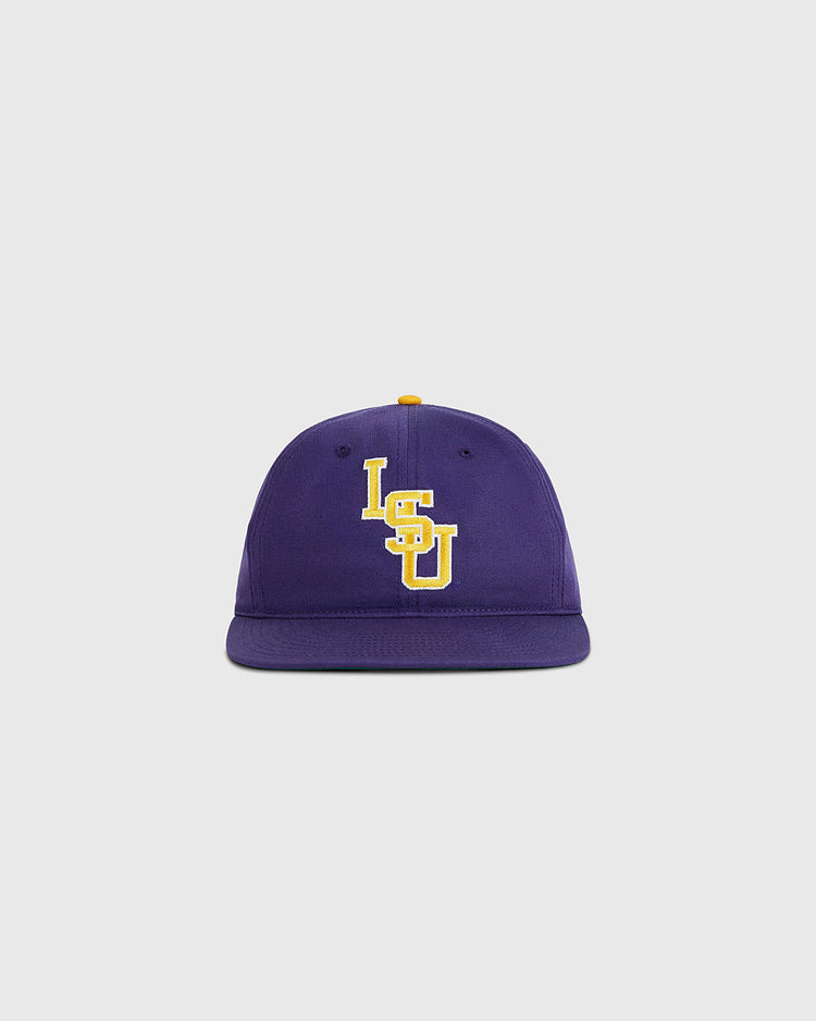 The Ebbets Field Louisiana State University 1987 Cotton Twill Ballcap features “LSU” embroidered in yellow and white on the front of a purple cotton twill cap, shown against a plain light gray background.