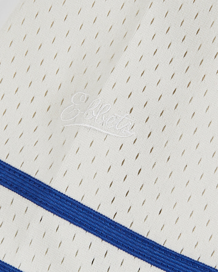 Close-up of the Jackie Robinson Comic Book Hero Button-Up Mesh Jersey by Ebbets Field, a white mesh jersey with small holes, 