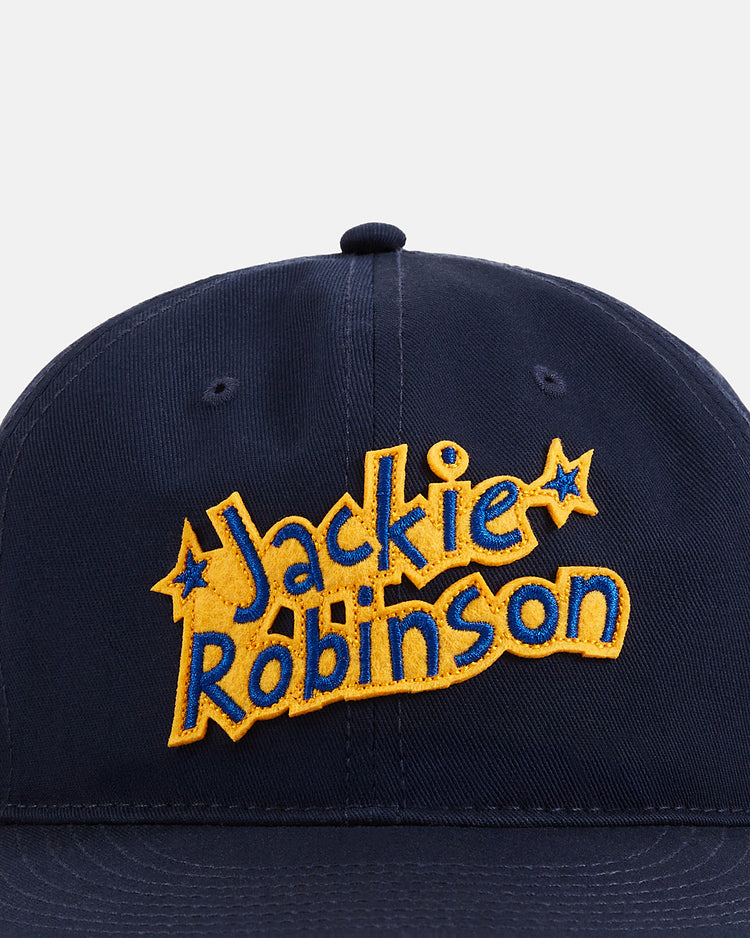 The Ebbets Field Jackie Robinson Comic Book Hero Cotton Twill Ballcap features a navy blue design, a yellow and blue front patch with 