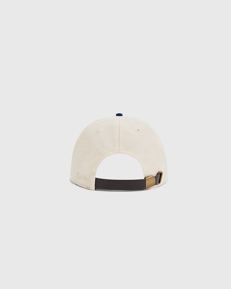 The Ebbets Field Jackie Robinson Comic Book Hero Cotton Twill Ballcap, shown from the back, has a beige color and features an adjustable dark brown strap with a metallic buckle against a plain light background.