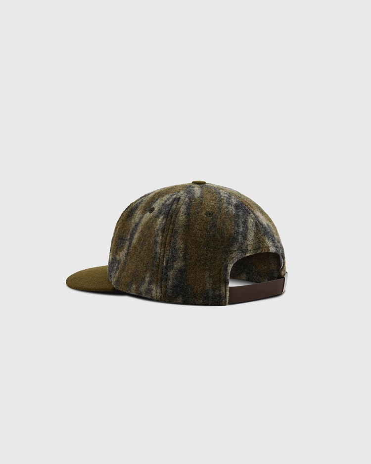 The Ebbets Field Mossy Oak x Ebbets Field Blank Ballcap, shown from the back against a light gray background, features a brown and green camo pattern with an adjustable leather strap and flat brim.