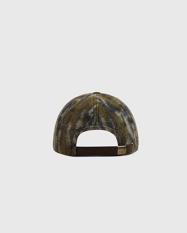 A rear view of the Ebbets Field Mossy Oak x Ebbets Field Vintage Tree Logo Ballcap shows its camouflage pattern, brown adjustable strap, and metallic buckle, set against a plain light background.
