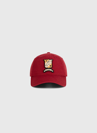A red Ebbets Field Los Angeles Lincoln Park Roller Skating Rink Washed Cotton Ballcap features a colorful embroidered patch with a shield, stars, and 