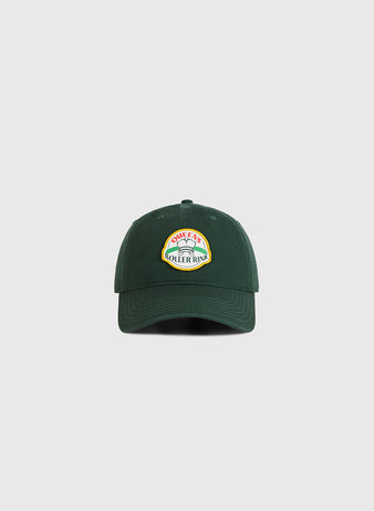 The Queens Roller Rink Washed Cotton Ballcap by Ebbets Field is a dark green vintage hat with a colorful 