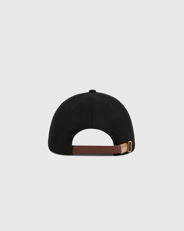 The Ebbets Field Chicago City Series Wool Ballcap, shown from the back, features a brown adjustable strap with a gold buckle. Crafted from genuine wool broadcloth, it's displayed against a plain light gray background.