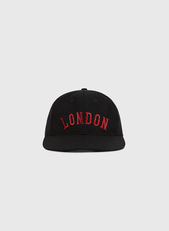 The Ebbets Field London City Series Wool Ballcap is a black baseball cap with 