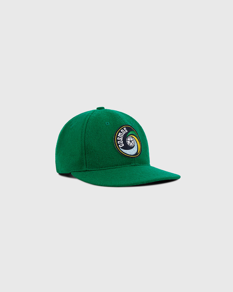 The Ebbets Field New York Cosmos Wool Ballcap is green with a curved brim and a front circular patch showing 