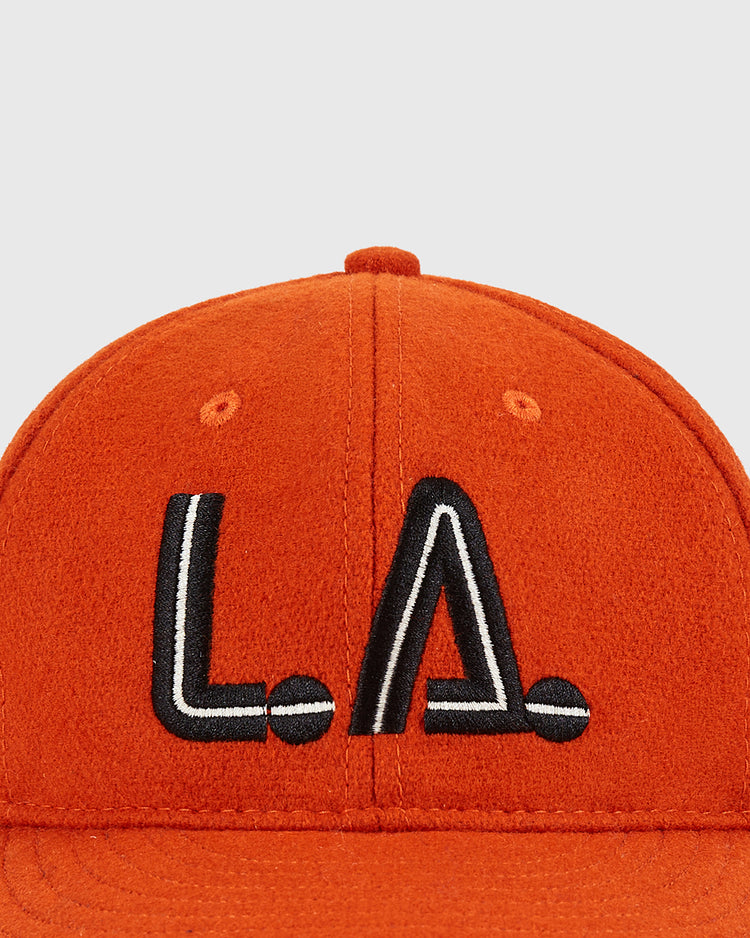 Close-up of the Ebbets Field Los Angeles Aztecs Vintage Wool Ballcap—an orange hat with black and white 