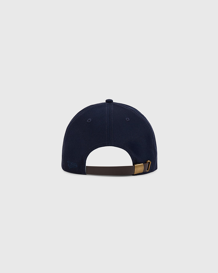 The Ebbets Field Pennsylvania Stoners Cotton Twill Ballcap is shown from the back, displaying its navy blue fabric, brown adjustable strap with metal buckle, and top button against a plain light gray background.