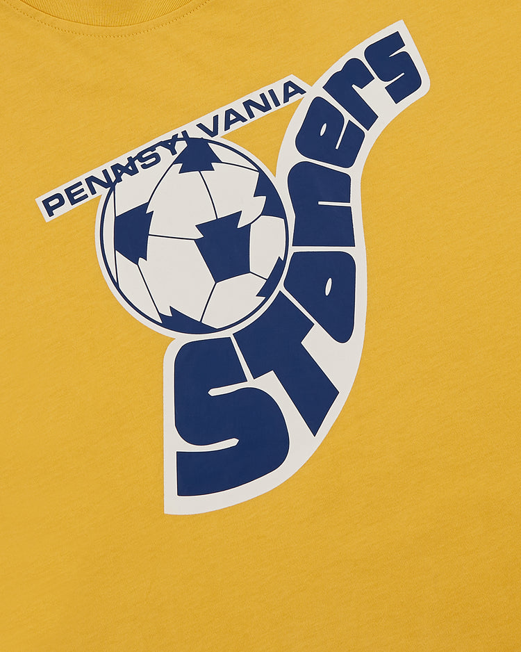 Ebbets Field’s Pennsylvania Stoners Short Sleeve Graphic T-Shirt features a yellow design with a blue and white soccer ball and bold 