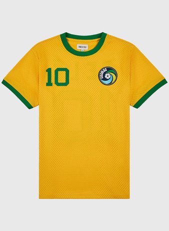 The Ebbets Field New York Cosmos Soccer Mesh Jersey is yellow with green collar and sleeve trim, inspired by Pelé’s iconic look, featuring a number 10 on the chest and a blue-and-white circular crest on the left side.