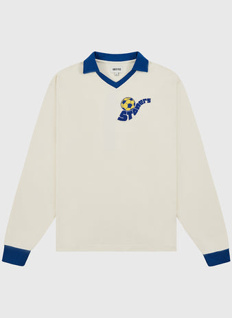 The Ebbets Field Pennsylvania Stoner Vintage Soccer Goalie Jersey is a cream-colored long sleeve jersey with blue collar and cuffs, and a yellow-blue soccer ball with 