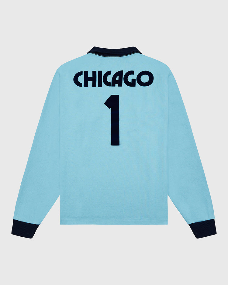 The Chicago Cats Vintage Soccer Goalie Jersey by Ebbets Field is a light blue, long sleeve, collared jersey with dark cuffs and collar. 
