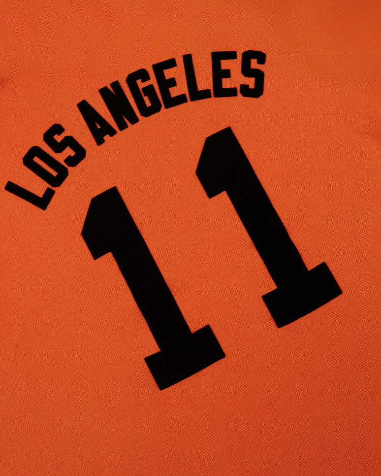 The Ebbets Field Los Angeles Aztecs Vintage Soccer Goalie Jersey features orange fabric, long sleeves, bold black LOS ANGELES text, and a large number 11, inspired by classic Aztecs designs.