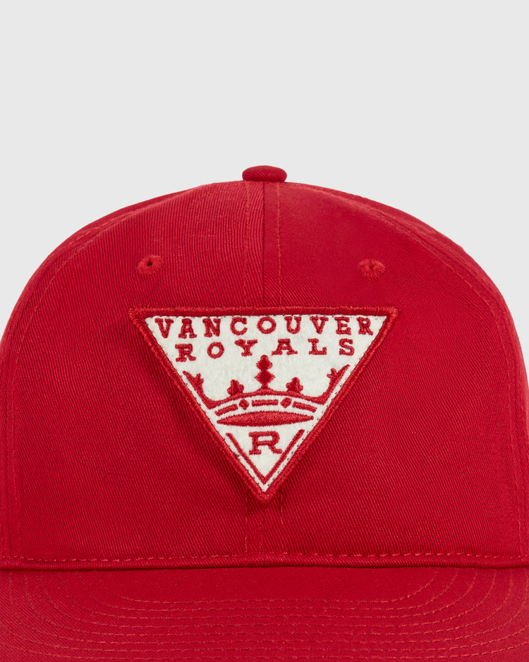 The Ebbets Field Vancouver Royals Cotton Twill Ballcap features a red design with a triangular white patch displaying VANCOUVER ROYALS above a crown and R—perfect for any Vancouver Royals ballcap collector.