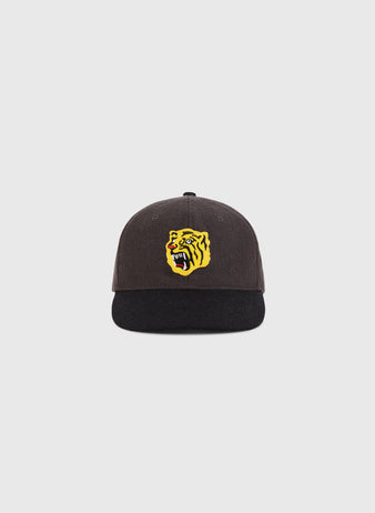 The Ebbets Field Osaka Tigers 1940 Wool Ballcap for youth features a dark design with a black brim and a yellow snarling tiger face on the front, shown against a plain light background.