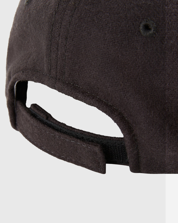 Close-up of the back of the Kansas City Katz 1961 Wool Ballcap (Youth Size) by Ebbets Field, showing its fabric strap and hook-and-loop fastener for size adjustment against a light gray background. The cap’s wool texture is clearly visible.