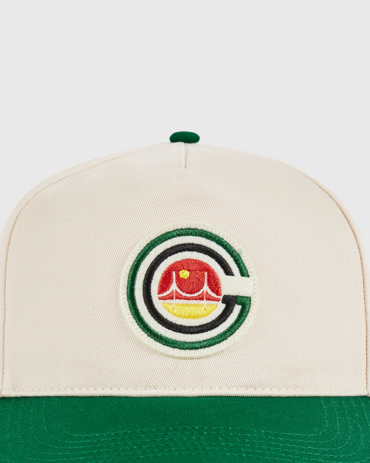 The Ebbets Field San Francisco Golden Gate Gales A-Frame Cotton Twill Ballcap features cream cotton twill, a green brim, and an embroidered patch with a stylized C encircling a red and yellow crown for vintage Gales flair.