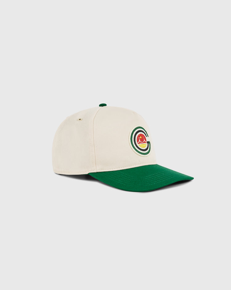 The San Francisco Golden Gate Gales A-Frame Cotton Twill Ballcap by Ebbets Field features a cream crown, dark green brim, and a circular embroidered logo in red, yellow, and green on the front, inspired by retro snapback style. Displayed on white background.