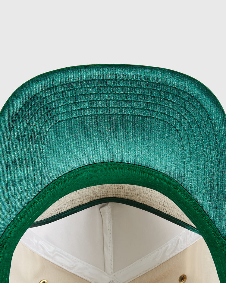 Close-up of the underside of an Ebbets Field San Francisco Golden Gate Gales A-Frame Cotton Twill Ballcap, featuring a white interior lining, gold eyelets, and detailed brim stitching. This retro snapback showcases classic style and craftsmanship.