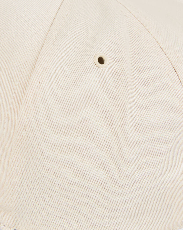 Close-up of the New Jersey Americans A-Frame Cotton Twill Ballcap by Ebbets Field, highlighting its beige embroidery, fine stitching, and a small metal ventilation eyelet.