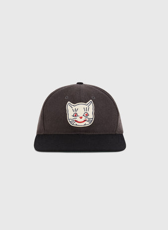 The Ebbets Field Kansas City Katz 1961 Wool Ballcap features a dark gray crown, black brim, and an embroidered white cartoon cat face with red eyes and nose—perfect for fans of the classic team.