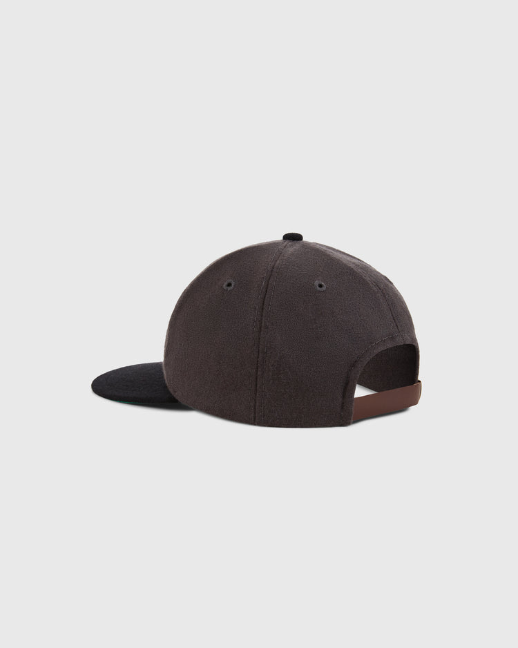 The Ebbets Field Kansas City Katz 1961 Wool Ballcap is shown from the back, displaying its black visor and adjustable brown strap. The vintage cap rests against a plain light gray background.