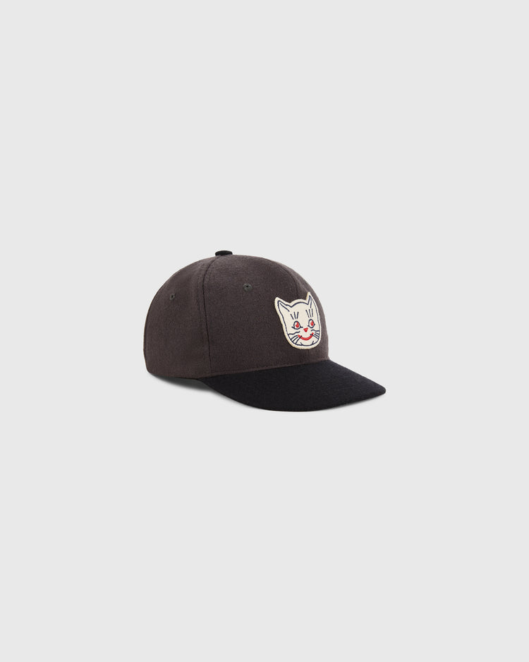 The Ebbets Field Kansas City Katz 1961 Wool Ballcap for youth features a curved brim and a front patch with a cartoon cat face, shown in black against a plain light gray background.
