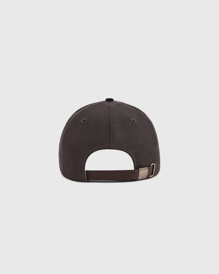 The Ebbets Field Osaka Tigers 1940 Wool Ballcap is shown from the back, displaying its dark gray wool fabric and a brown adjustable strap with a metal buckle, set against a plain light background.